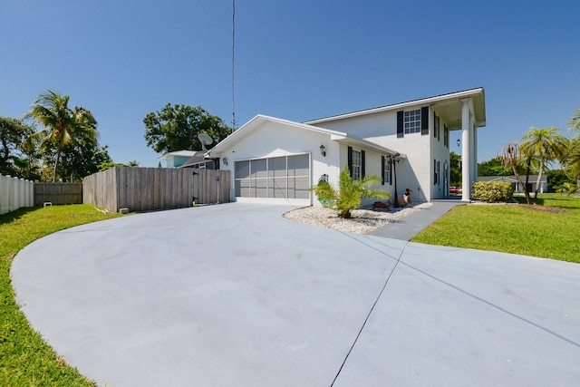 view of front facade featuring concrete driveway and an attached garage