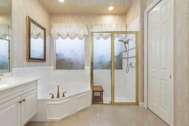 full bath with wallpapered walls, a stall shower, a wainscoted wall, a garden tub, and vanity