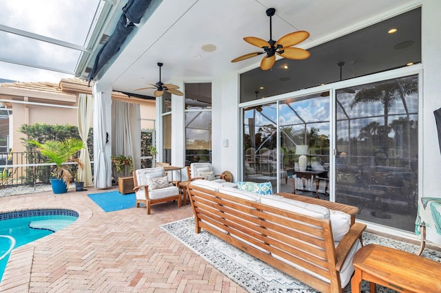 view of patio with a lanai, an outdoor hangout area, and ceiling fan