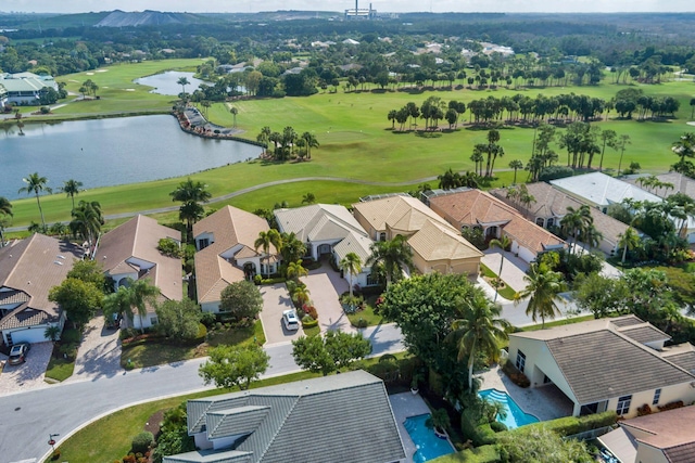 bird's eye view featuring a water view, view of golf course, and a residential view