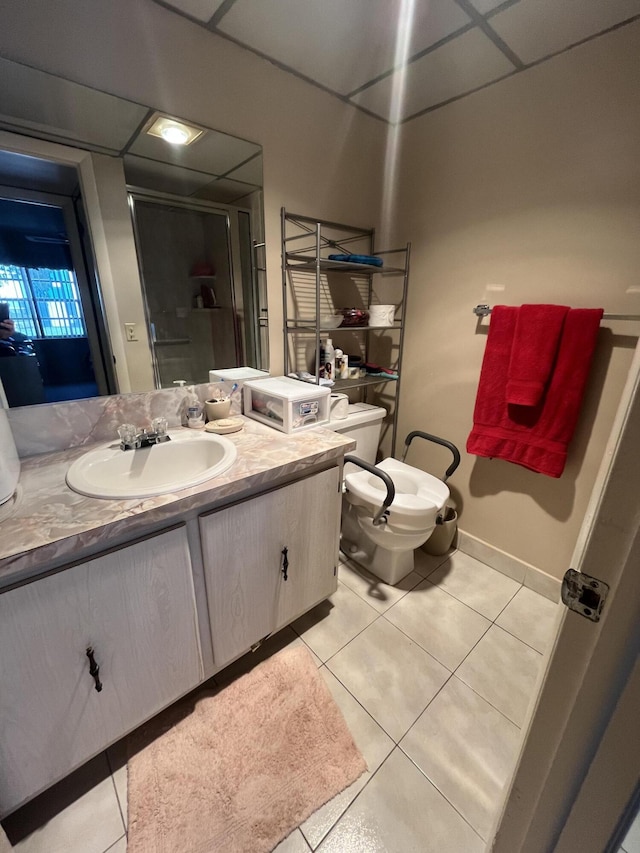 bathroom featuring vanity, tile patterned floors, and toilet