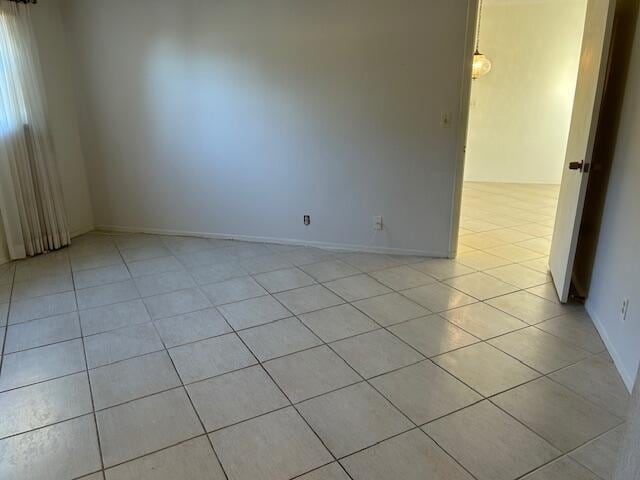 spare room with light tile patterned floors