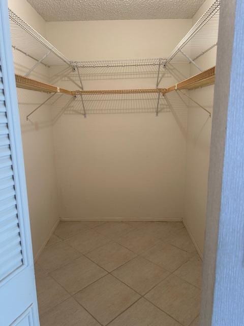 walk in closet featuring tile patterned floors