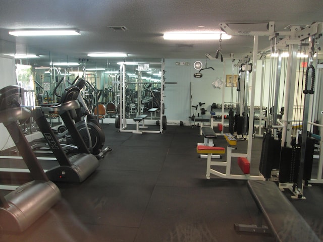 workout area with a textured ceiling