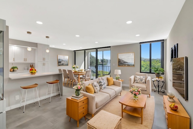 living room with expansive windows and a wealth of natural light