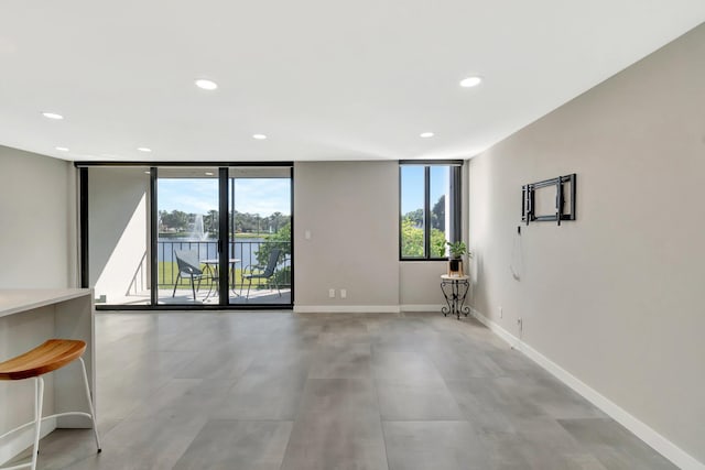 empty room with a wealth of natural light and floor to ceiling windows