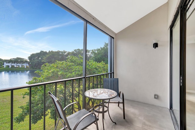 balcony featuring a water view