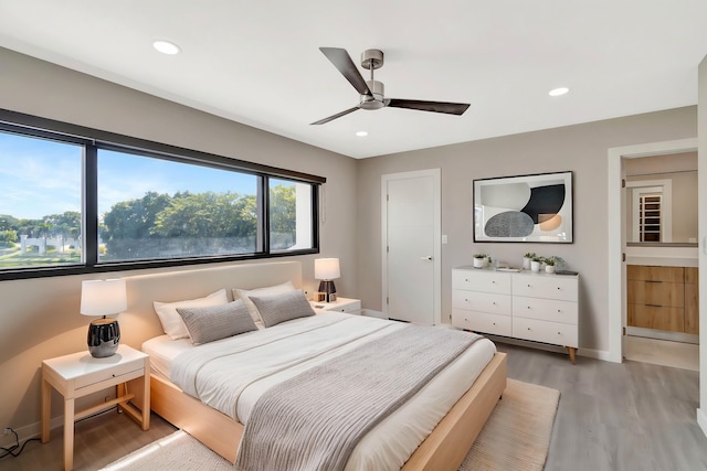 bedroom featuring hardwood / wood-style flooring and ceiling fan