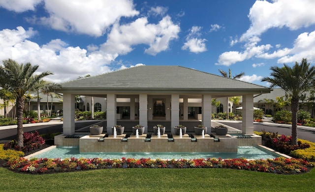 view of property's community with a gazebo and a lawn