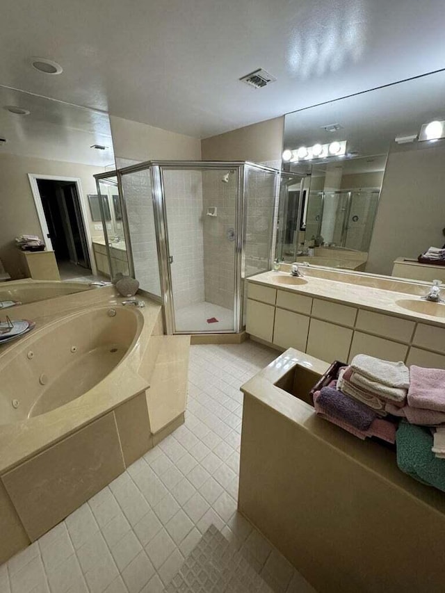 bathroom with vanity, tile patterned floors, and independent shower and bath