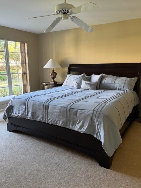 bedroom featuring carpet floors and ceiling fan