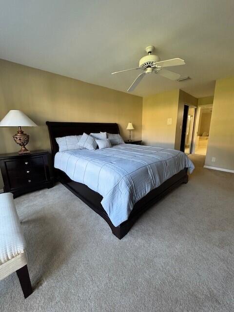 bedroom with ceiling fan and carpet flooring