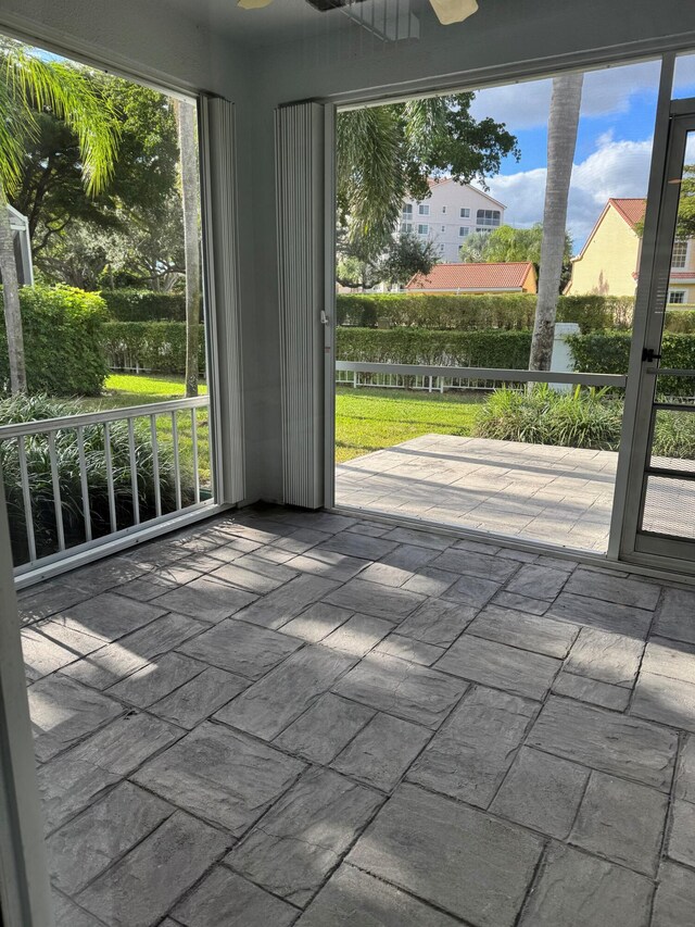 unfurnished sunroom with plenty of natural light