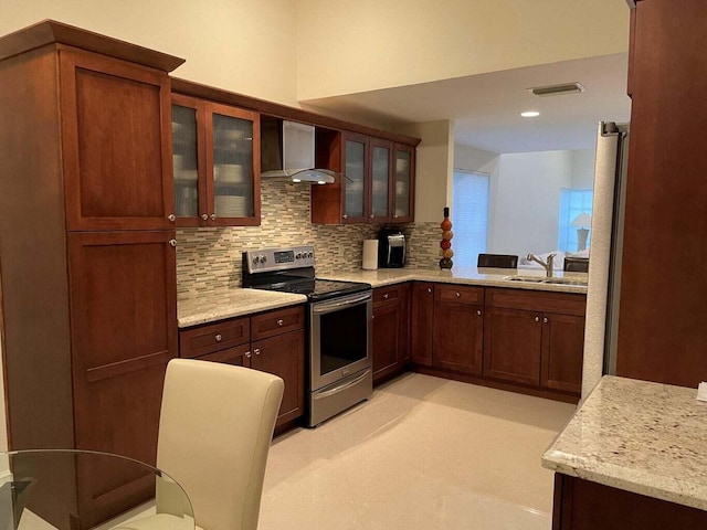 kitchen featuring tasteful backsplash, sink, electric range, light stone countertops, and wall chimney exhaust hood