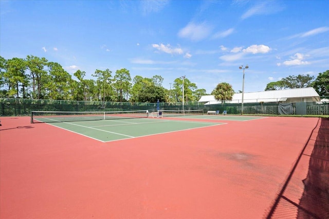 view of sport court featuring basketball hoop