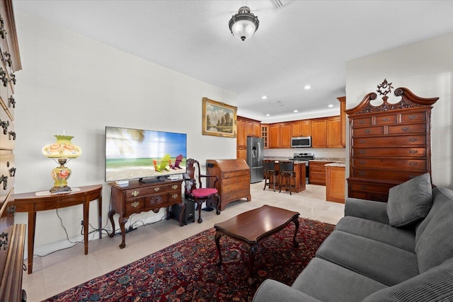 living room with light tile patterned flooring