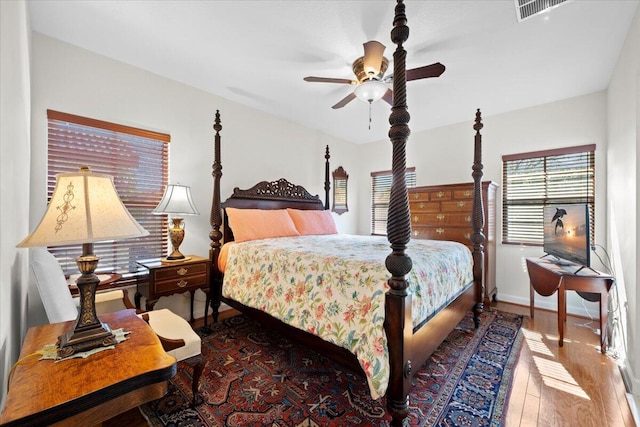 bedroom with hardwood / wood-style flooring and ceiling fan