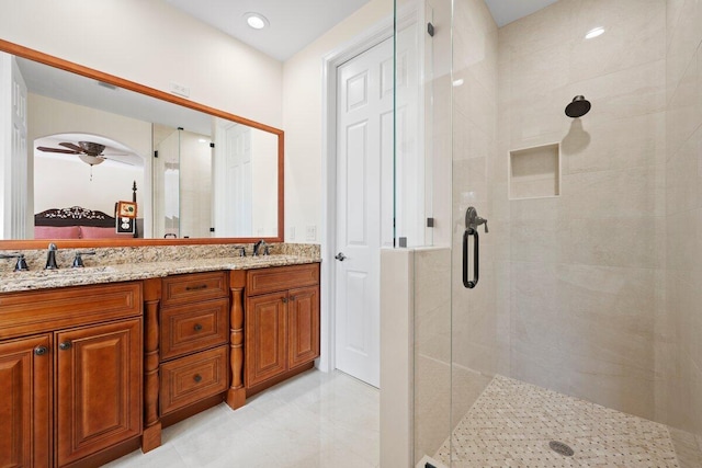 bathroom featuring vanity and an enclosed shower