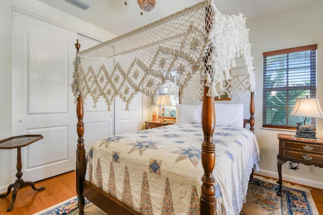 bedroom with wood-type flooring