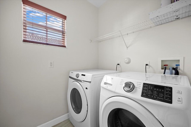 washroom with washer and dryer