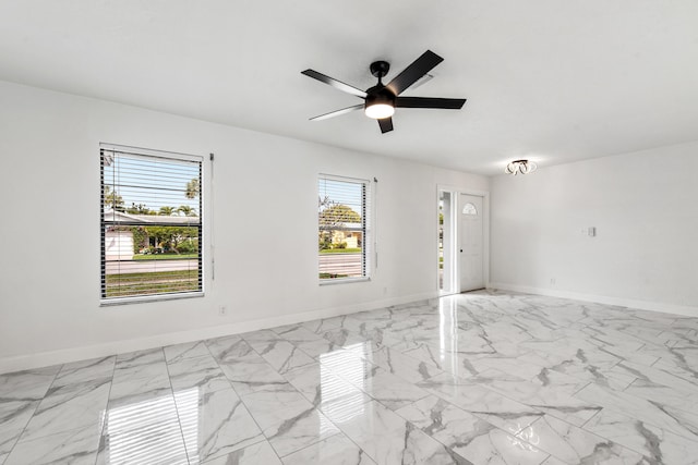 spare room with ceiling fan