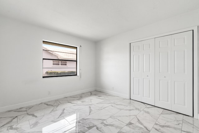 unfurnished bedroom featuring a closet