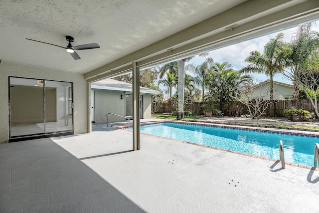 view of pool featuring ceiling fan and a patio