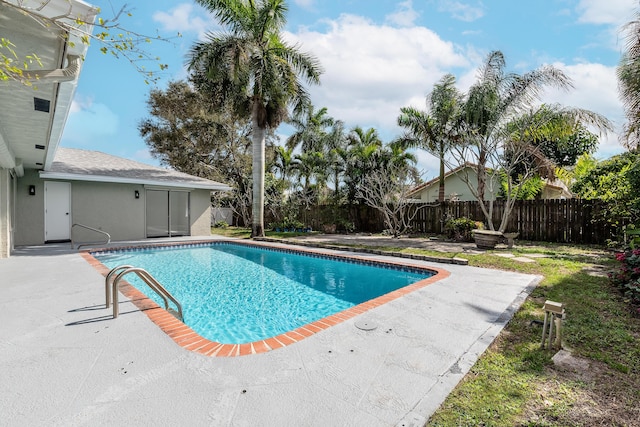 view of swimming pool with a patio