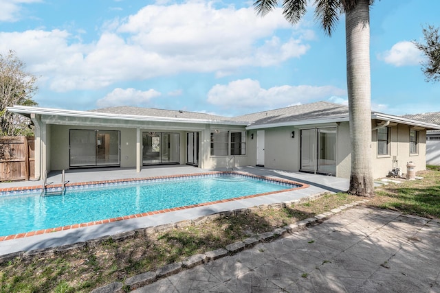 rear view of property featuring a patio