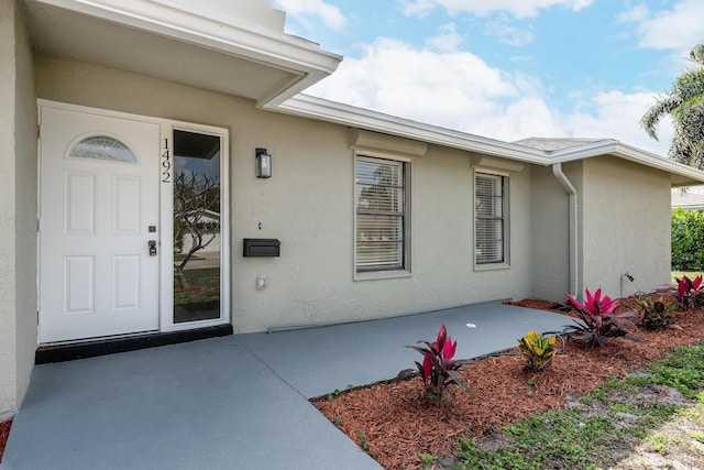 doorway to property featuring a patio area