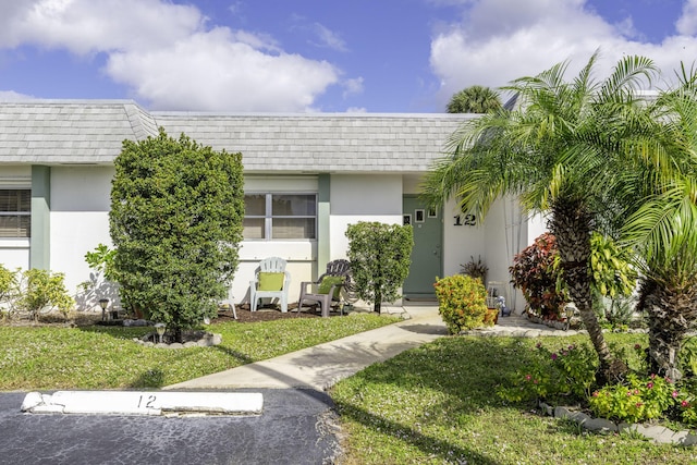 entrance to property with a yard