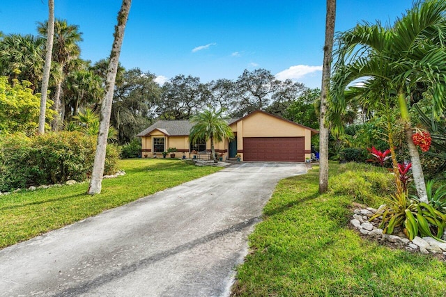 ranch-style home with a garage and a front lawn