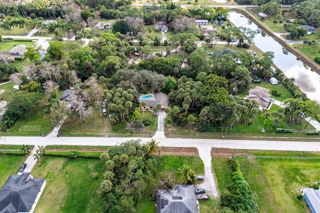 birds eye view of property featuring a water view