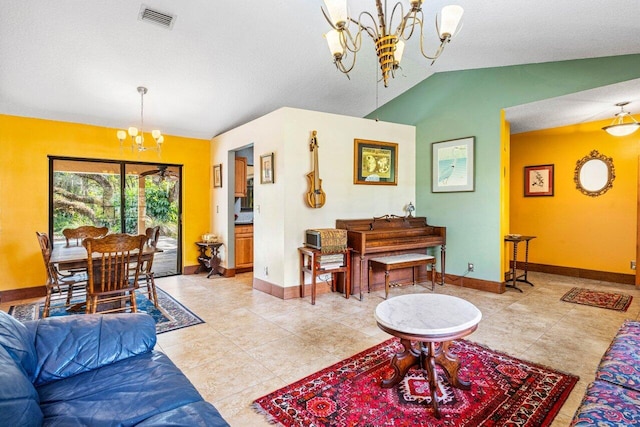 living room featuring a notable chandelier, light tile patterned floors, vaulted ceiling, and a textured ceiling