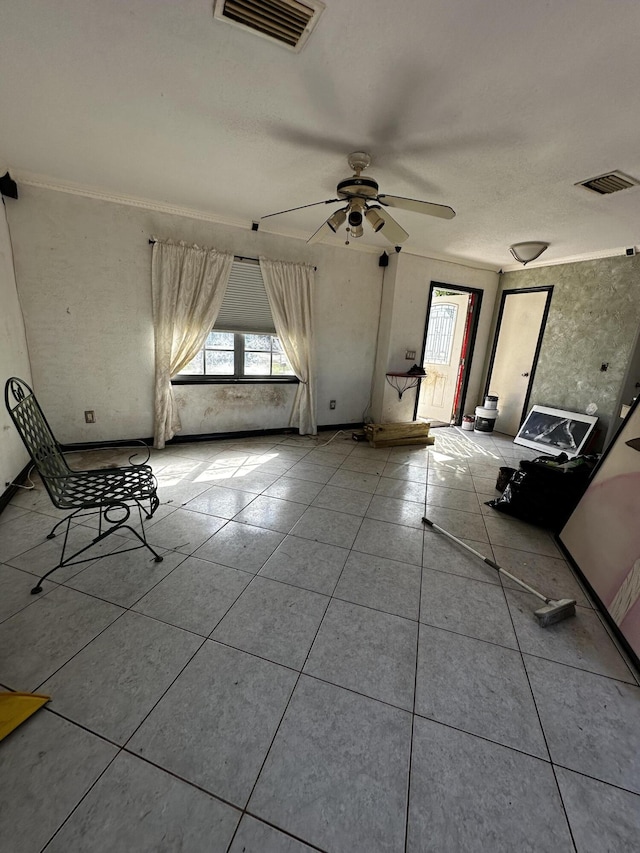 interior space featuring tile patterned floors, a healthy amount of sunlight, and visible vents