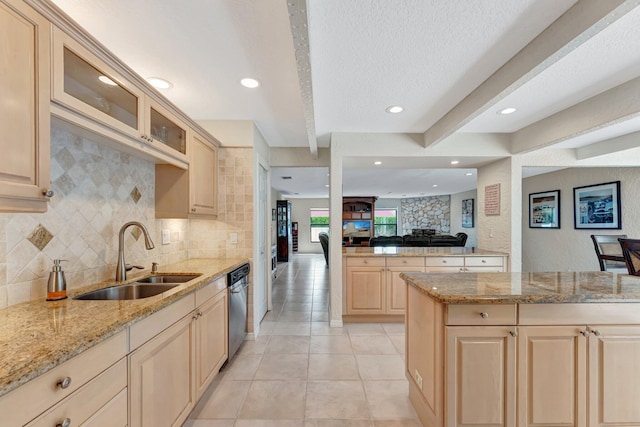 kitchen with sink, backsplash, light tile patterned floors, light brown cabinets, and beam ceiling