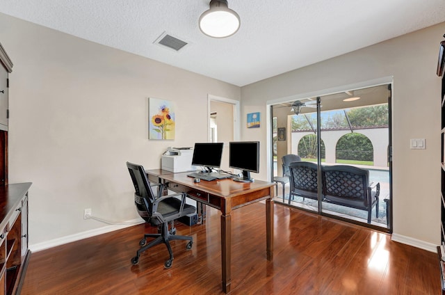 office area with ceiling fan, wood-type flooring, and a textured ceiling