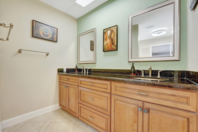 bathroom featuring tile patterned floors and vanity