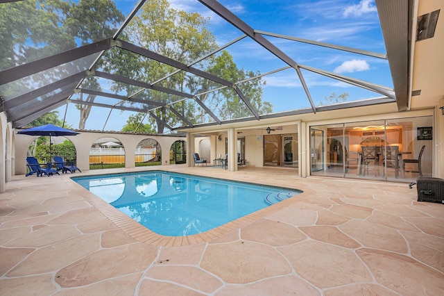 view of pool with a lanai and a patio area