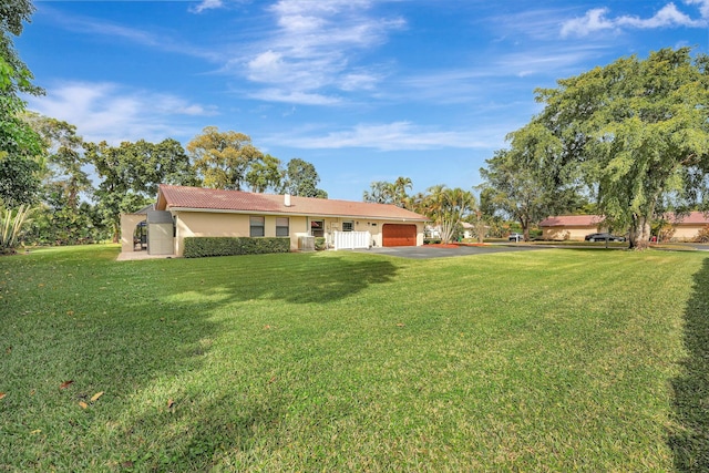 view of yard featuring a garage