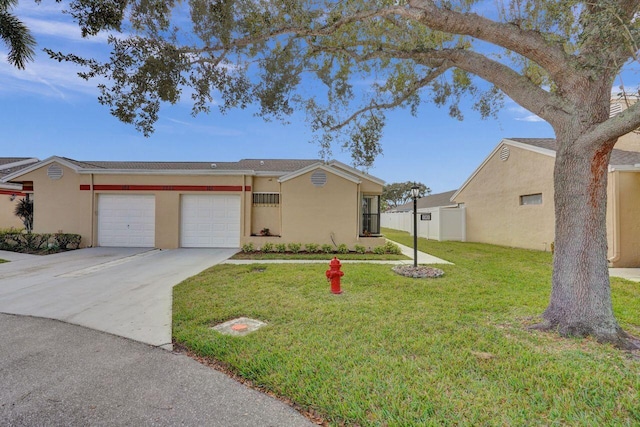 ranch-style home featuring a garage and a front lawn