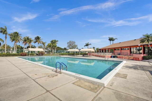 view of swimming pool featuring a patio area