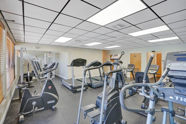 exercise room featuring a drop ceiling