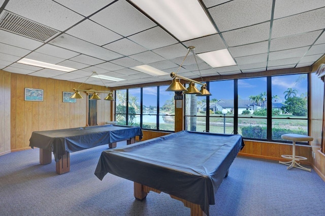 playroom with carpet, pool table, a drop ceiling, and wooden walls