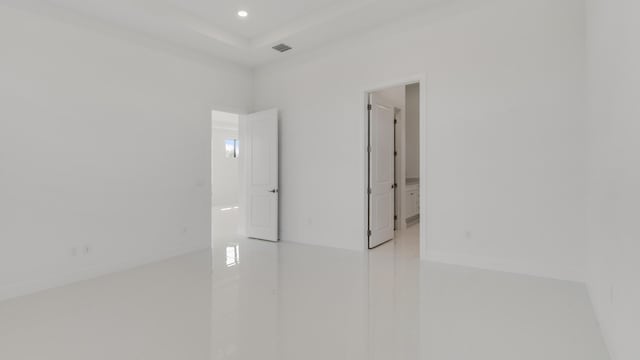 empty room featuring a tray ceiling