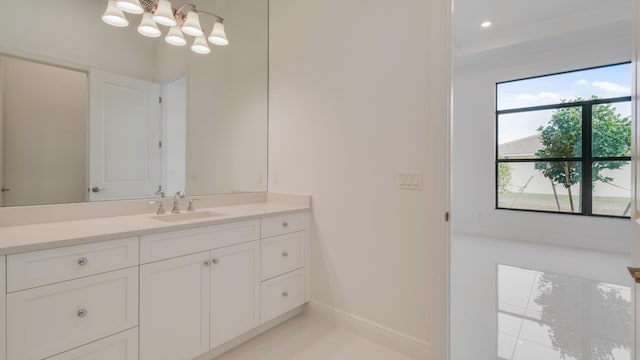 bathroom featuring vanity and a chandelier