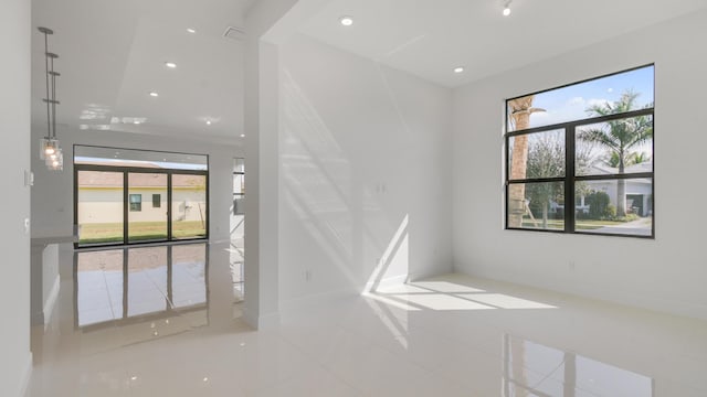 unfurnished room featuring tile patterned flooring