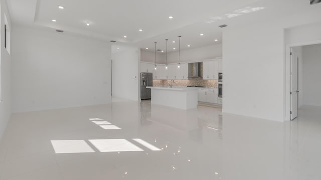 unfurnished living room with sink