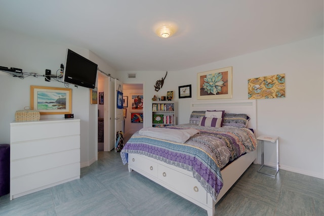 bedroom with a barn door