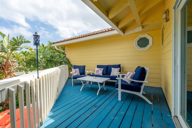 wooden deck featuring outdoor lounge area